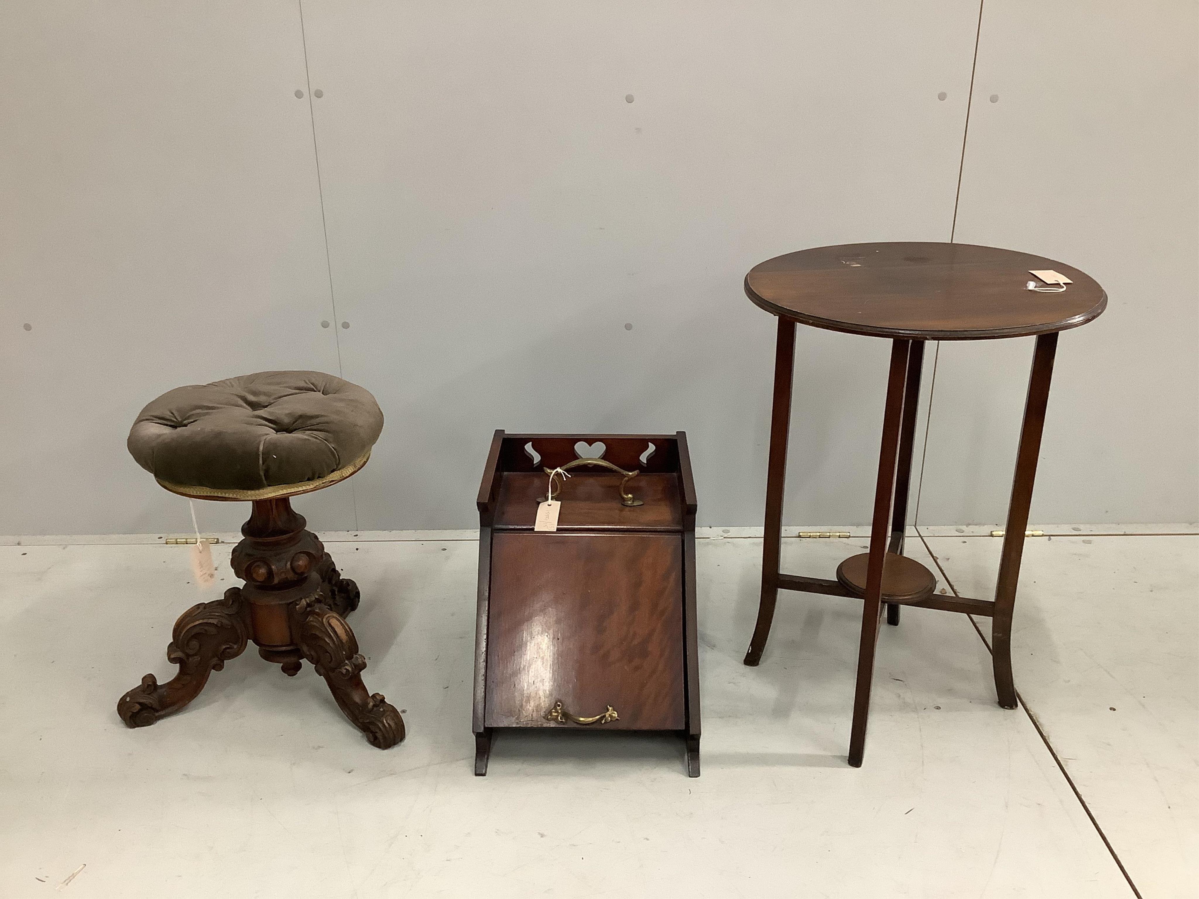 A Victorian circular adjustable piano stool, a late Victorian coal scuttle and an Edwardian drop flap occasional table. Condition - fair